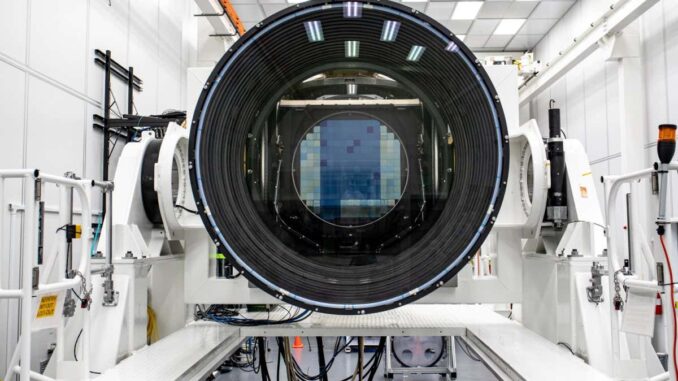 Researchers at SLAC National Accelerator Laboratory are nearly done with the LSST Camera, the world's largest digital camera ever built for astronomy. Roughly the size of a small car and weighing in at three tons, the camera features a five-foot wide front lens and a 3,200 megapixel sensor that will be cooled to -100??C to reduce noise. Once complete and in place atop the Vera C. Rubin Observatory's Simonyi Survey Telescope in Chile, the camera will survey the southern night sky for a decade, creating a trove of data that scientists will pore over to better understand some of the universe's biggest mysteries, including the nature of dark energy and dark matter. (Jacqueline Ramseyer Orrell/SLAC National Accelerator Laboratory)